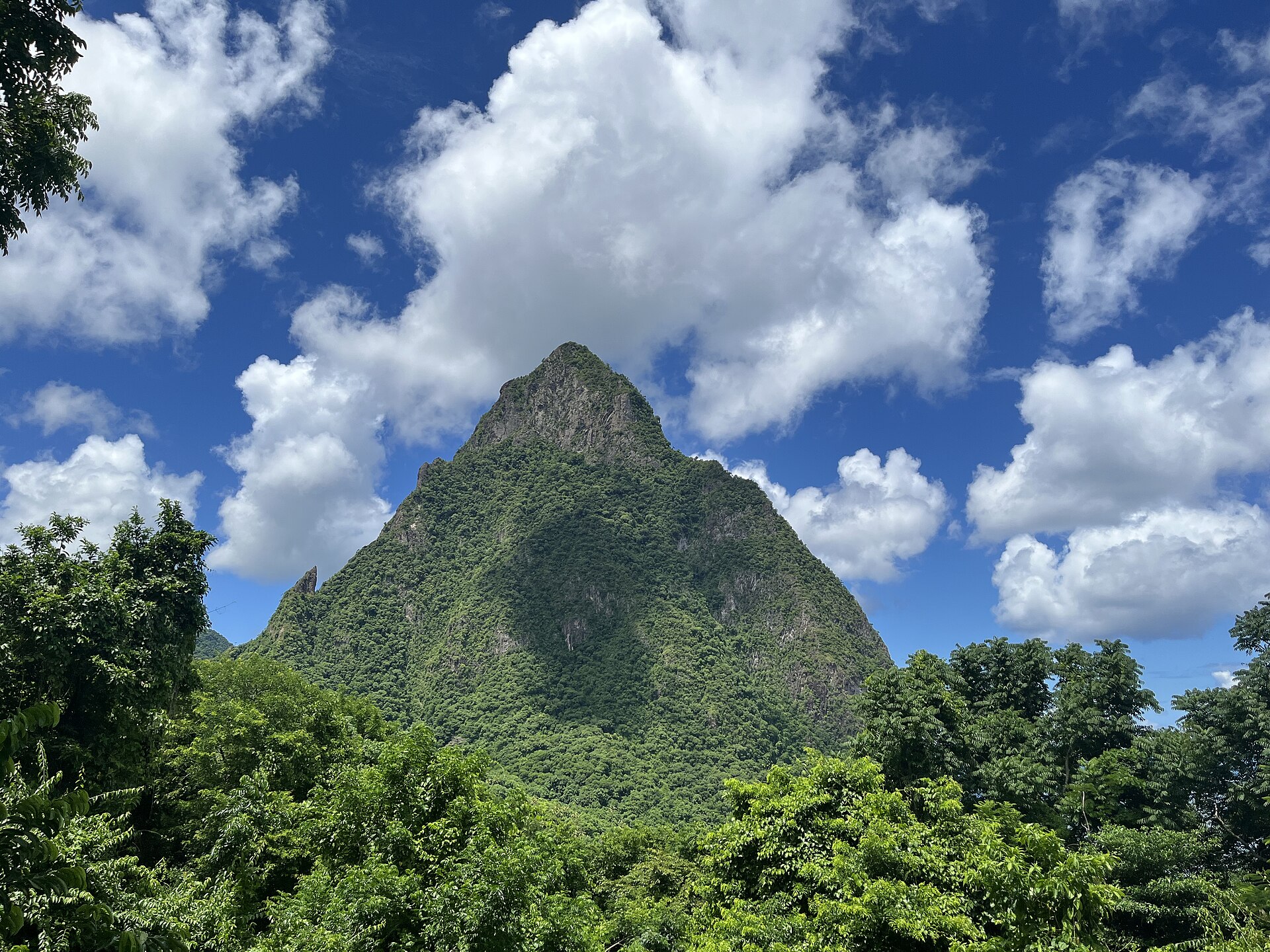 The green peak of Petit Piton rising above the sea, St Lucia